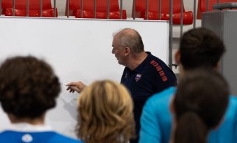 Guy delivering instructions to the youth players