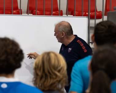 Guy delivering instructions to the youth players